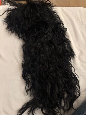 Unisex black mullet wig short hair on top longer at bottom.